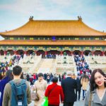 Tourists exploring the iconic Forbidden City in Beijing, a UNESCO World Heritage Site.